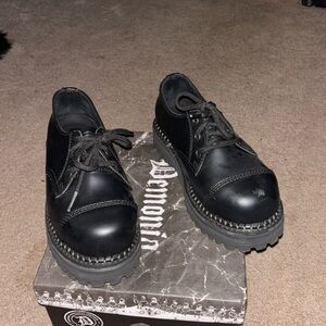 Black demonia steel toe shoes